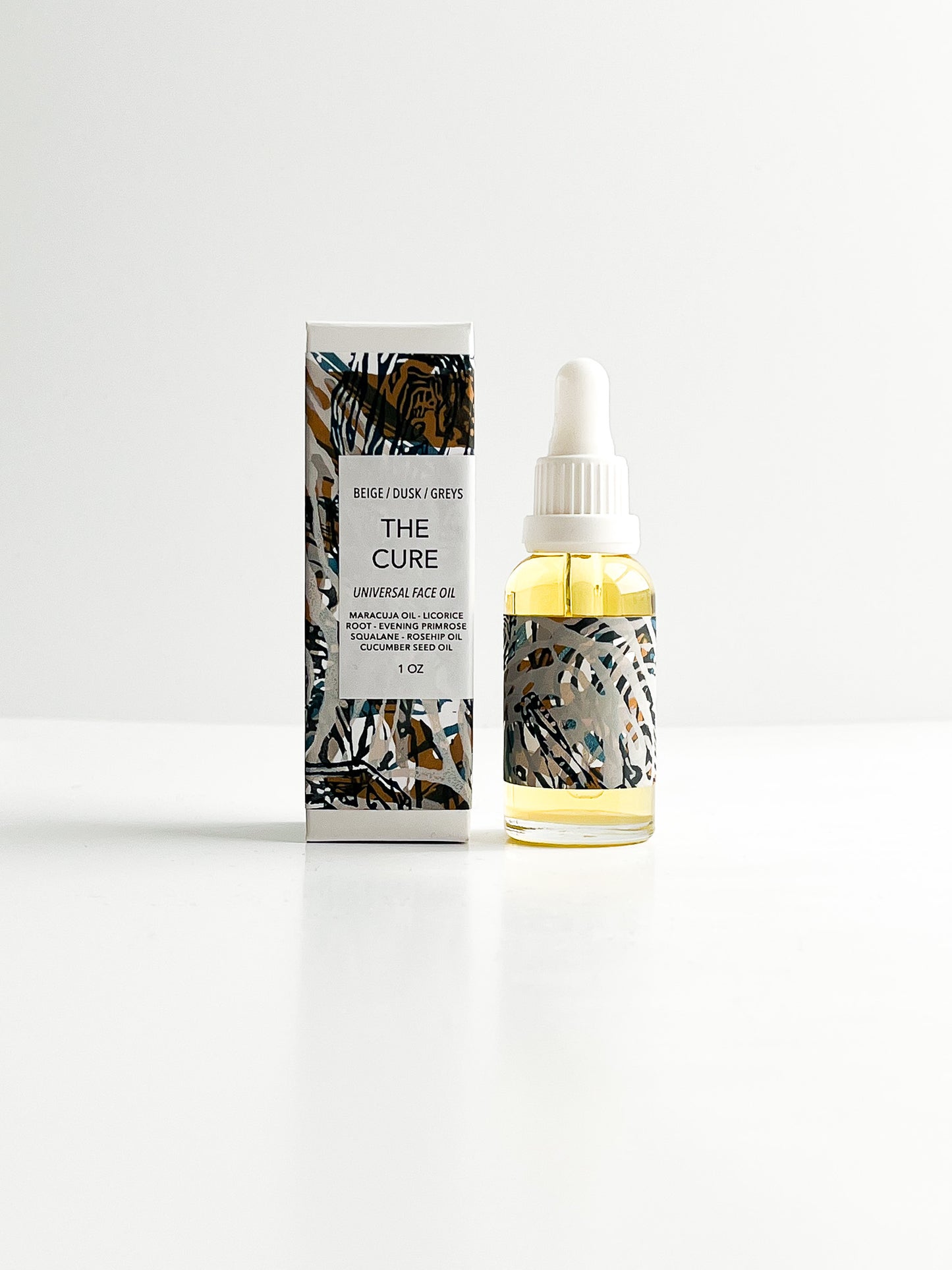 THE CURE universal face oil with rare emollients & botanical infusions