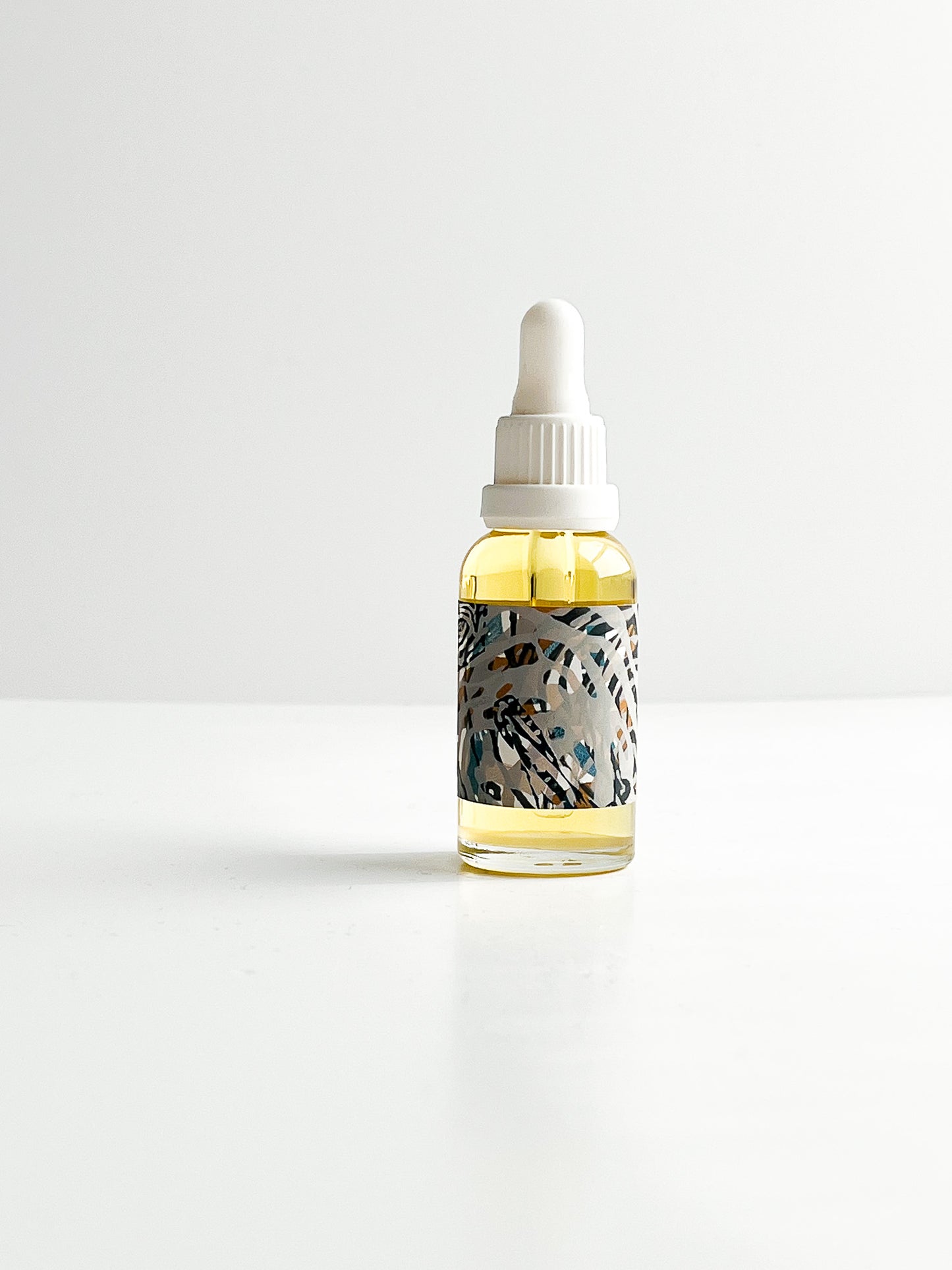THE CURE universal face oil with rare emollients & botanical infusions